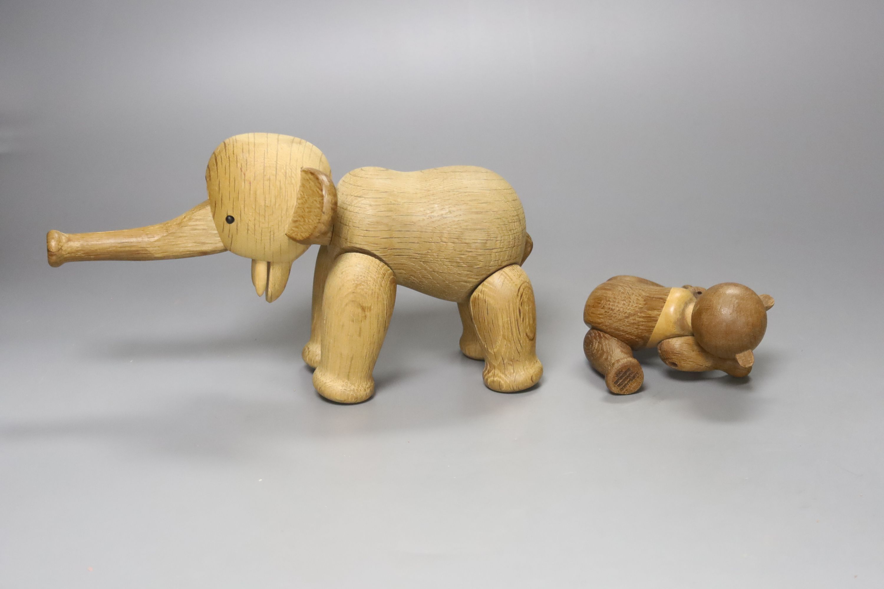 Two Danish carved wooden toys by Kay Bogesen, a standing elephant, 22cm length 14cm high and a seated bear, 10cm high
